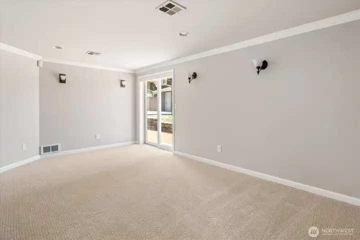 Photo of bonus room/den without staging.