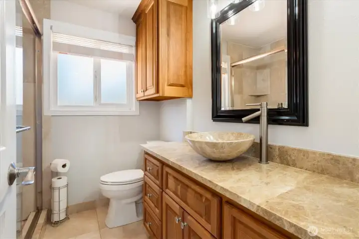 Guest bathroom with walk-in shower.