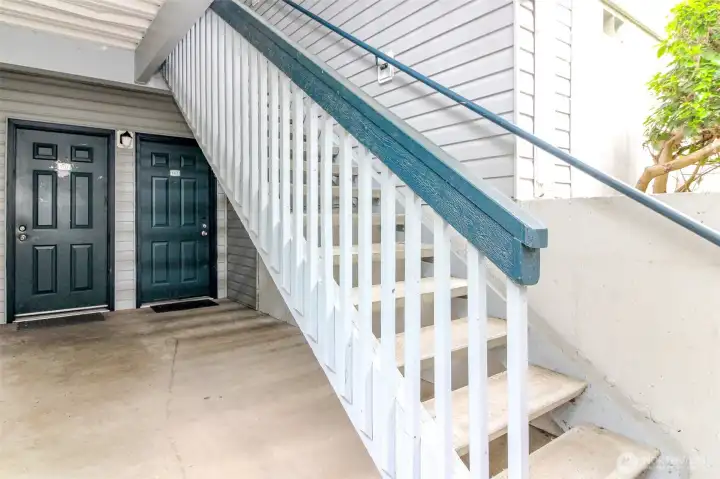 Ground floor unit. Door located under the stairs