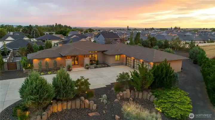 An iconic Northwest Contemporary estate, perfectly framed by the evening sky.