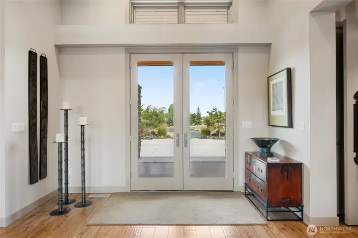 An entry that immediately captures the home's signature blend of light, space, and architectural elegance