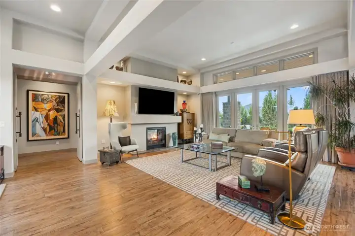 The heart of the home is a breathtaking great room where soaring beamed ceilings, walls of windows, and thoughtfully curated finishes create an inviting space designed for both grand entertaining and everyday living