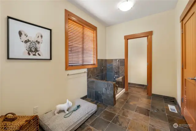 Located just off the rear entrance is a luxury mud room complete with your own dog bathing area! There is also a half bath just thru the door.