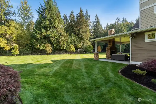 Northwest greenery make for a natural private setting. The backyard has a sprinkler system and is completely fenced.