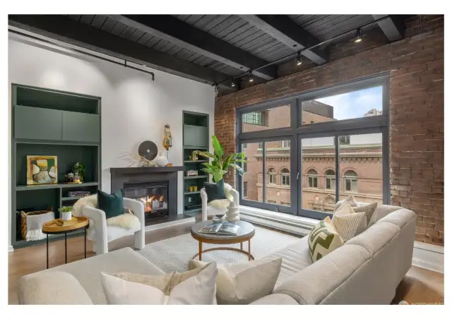 Cozy living room with a wood burning fireplace and original large windows which pivot to open