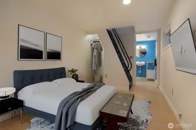 Cottage (North) home lower level bedroom with a separate entrance and alternating tread staircase.  Virtually staged photo.