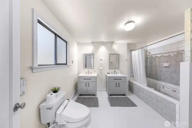 New bathroom floors, vanities, and mirrors