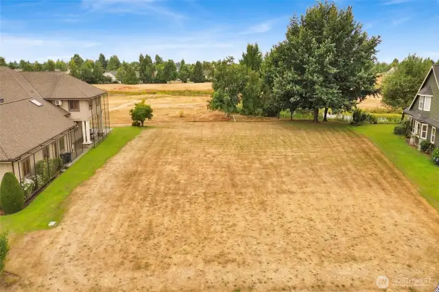 Welcome to the gated community of Island Green Way and one of the very last buildable lots left on the Homestead Golf course!