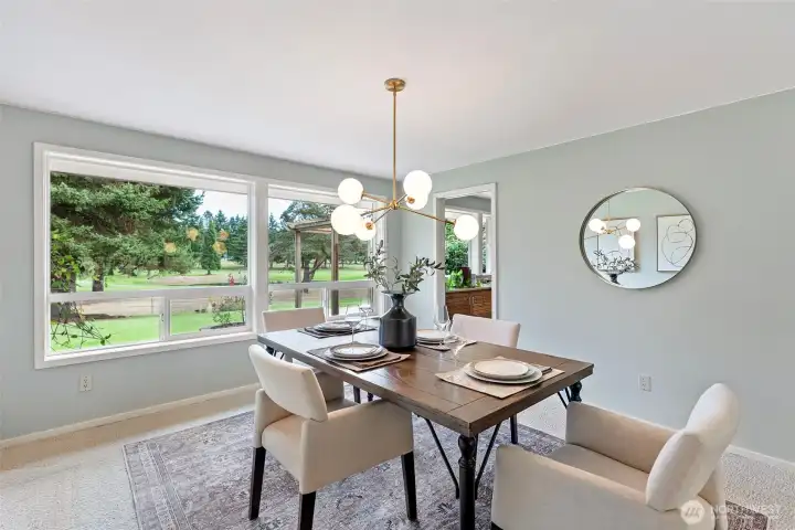 Formal dining room with views of the golf course.