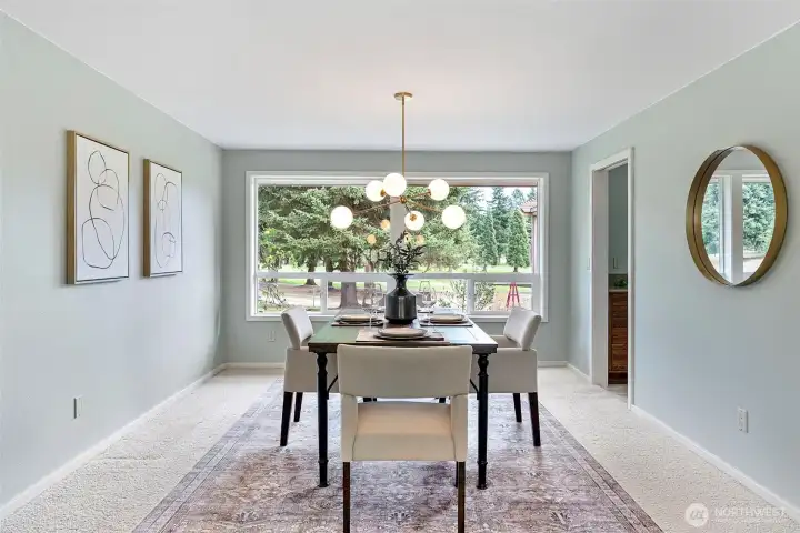 Formal dining room with views of the golf course.