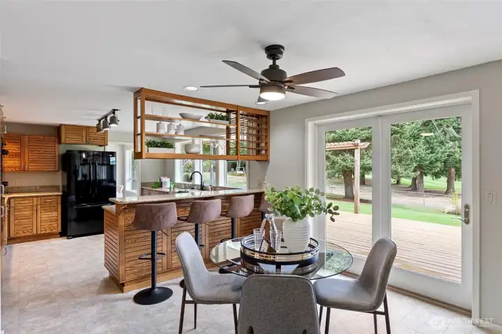 Informal dining space and kitchen with eating space.