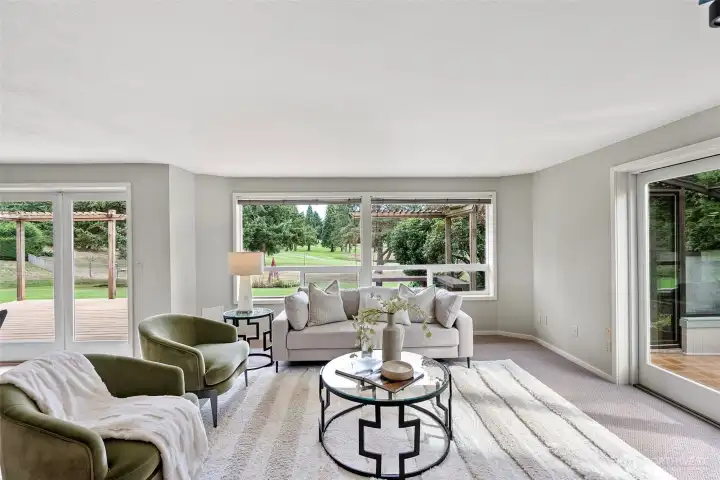 Informal dining space with deck/backyard access and entrance to the sunroom.