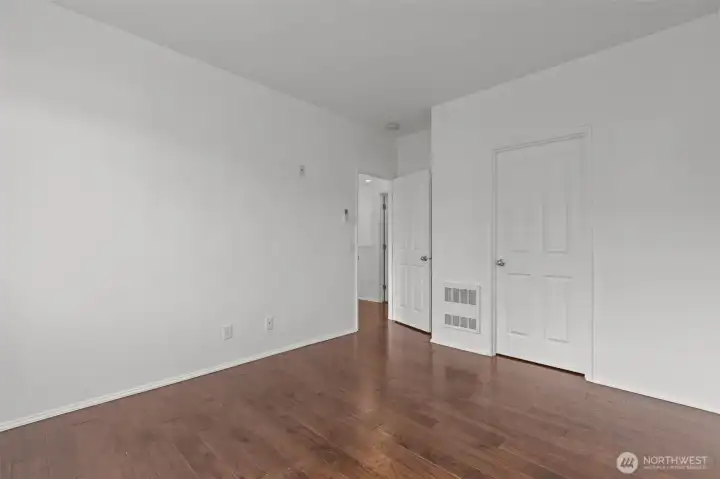 Comfortable primary bedroom with walk-in closet and abundant natural light