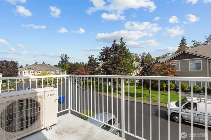 Private deck overlooking community greenery—great for relaxing outdoors