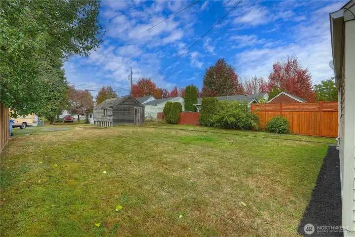 With alley access, there is available parking in both the back and front of the home.  The over-sized flat lot also features space to build an ADU or add other structures. Enjoy the room to grow!