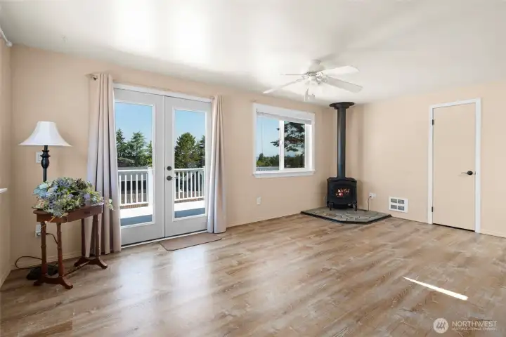 Another view of the living area with doors to the deck.