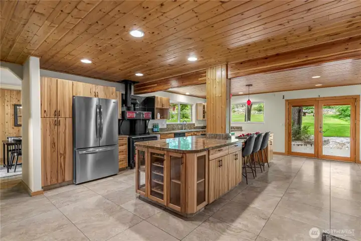 With its chef-ready range, and open flow to spacious dining and lounging areas, this warm and woodsy retreat is built for hosting any type of gathering!