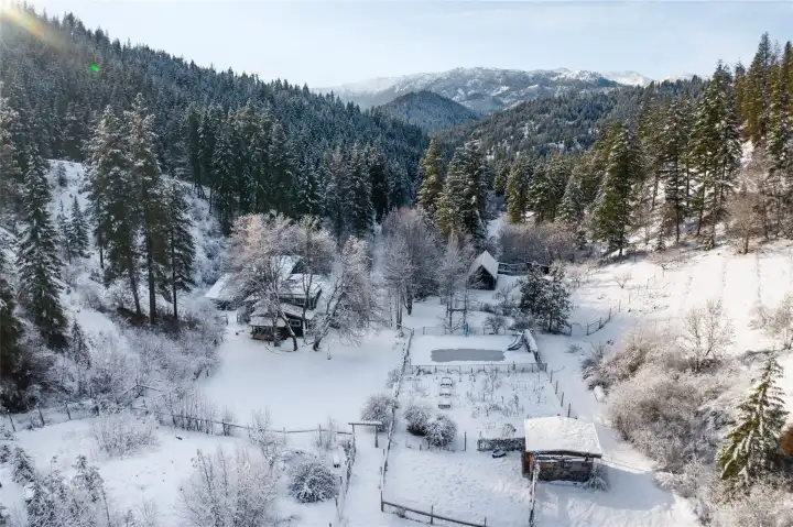Magnificent SNOW setting, with 20-acres, buffered by US Forest Service Land to the east.