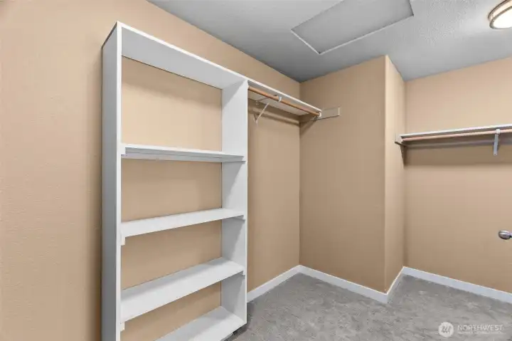 Primary bathroom walk in closet.