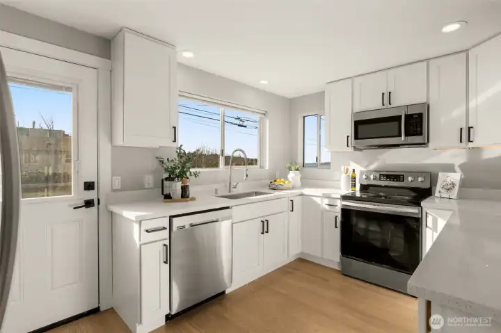 Compact chefs kitchen with views of Puget Sound