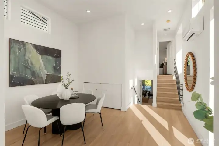 High ceilings, hard wood floors and soaring windows. Fantastic dining space.