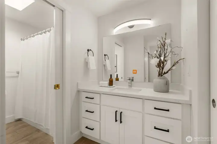 Vanity space in primary is next to the walk through closet. So much space for your toiletries to be tucked away.
