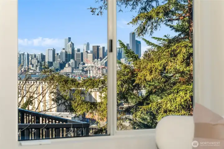 View from the primary bedroom. Tree in foreground slated for possible removal with the light rail coming.