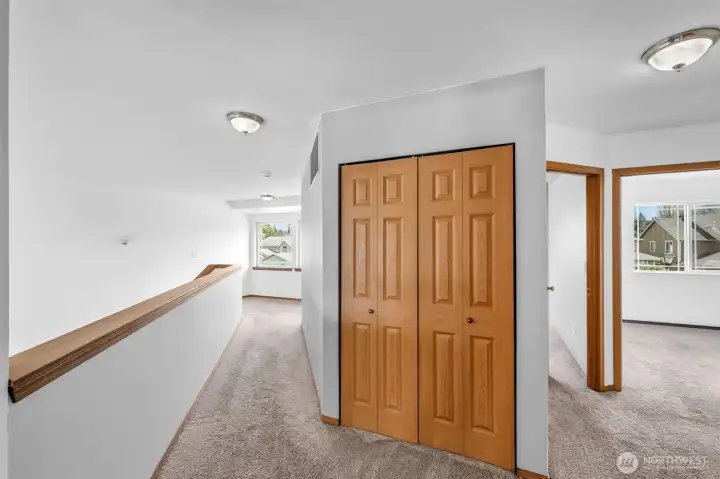 Great windows and long hallway & huge linen clostet