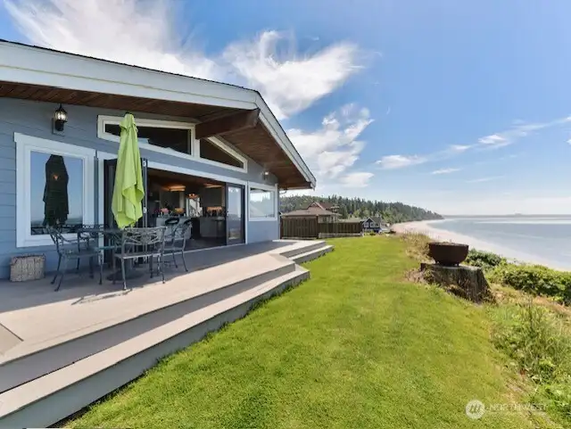 Large trex decking off the living room.  Nano doors folds back to open the living spacing to the outdoors.
