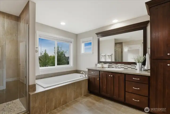 Primary bathroom, ensuite, tile floor, walk-in tile shower, soaking tub, separate vanities