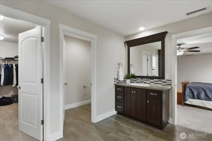 Primary bathroom, separate vanities, walk-in closet