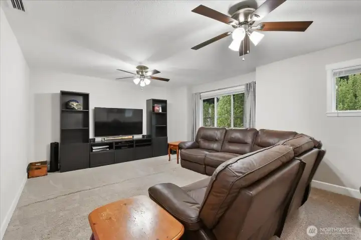 Bonus room, carpeted, ceiling fan, wired for surround sound