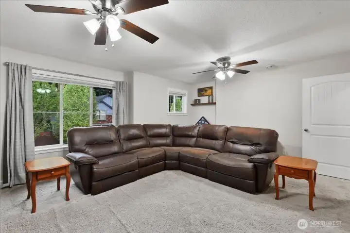 Bonus room, carpeted, ceiling fan, wired for surround sound