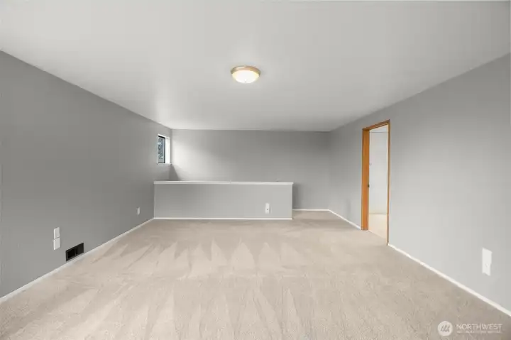 Primary bedroom with new paint and carpet