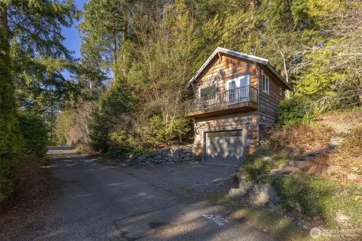 This cozy “cottage in the woods” has the Cape Cod feeling with the natural cedar shakes ans white trim. This cozy “cottage in the woods” has the Cape Cod feeling with the natural cedar shakes ans white trim.