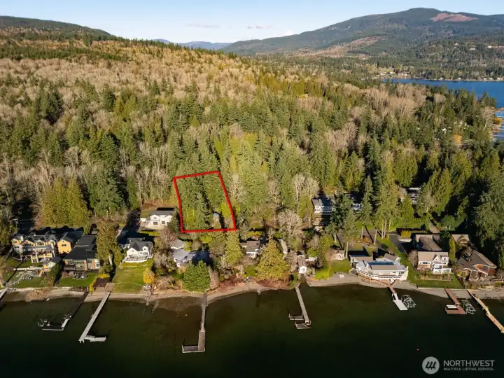 Looking at this home's proximity to the lake and the community beach. Looking at this home's proximity to the lake and the community beach.