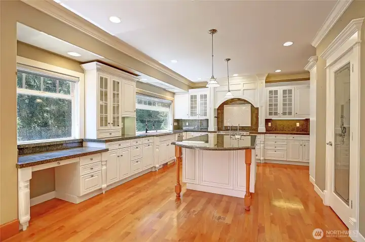 Gourmet kitchen with tons of natural light, ample storage and work space.