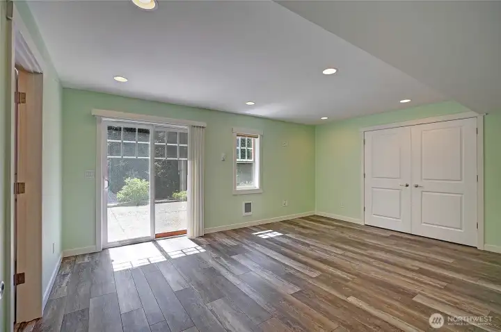 Primary suite on lower level, with access to huge patio & backyard.