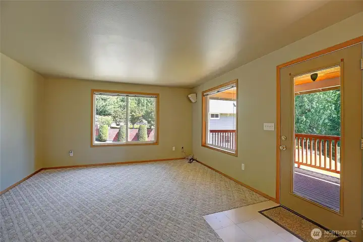 ADU Living room with access to deck.