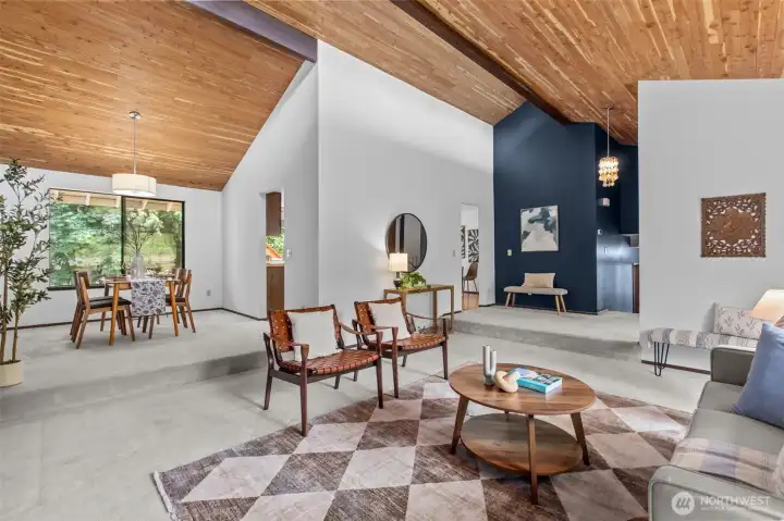 Enjoy the expansive living room with dramatic wood paneled ceilings throughout Enjoy the expansive living room with dramatic wood paneled ceilings throughout