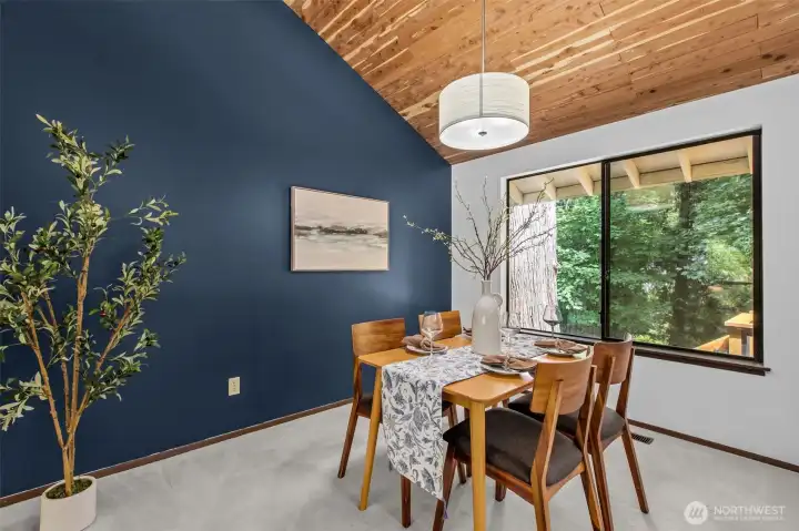 Enjoy the view of lush greenery from the dining room Enjoy the view of lush greenery from the dining room