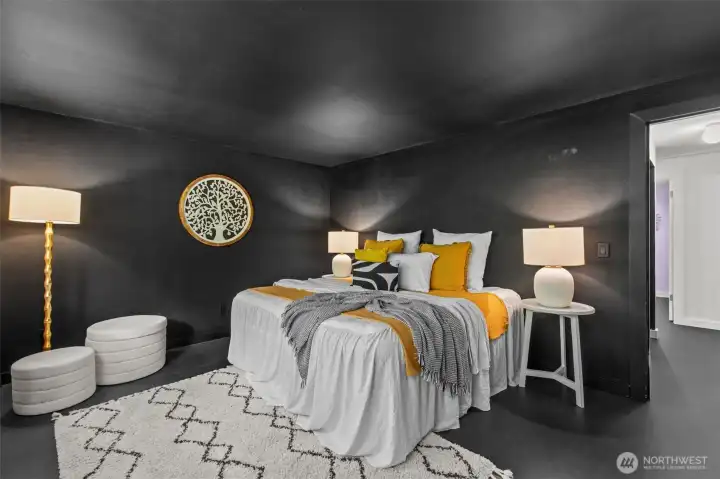 Dramatic primary suite features bold black finishes Dramatic primary suite features bold black finishes