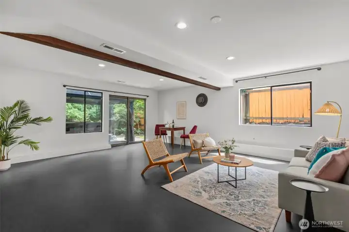 Expansive finished den in the lower level features Marmoleum flooring Expansive finished den in the lower level features Marmoleum flooring