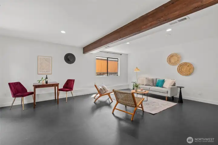Expansive finished den in the lower level features Marmoleum flooring Expansive finished den in the lower level features Marmoleum flooring