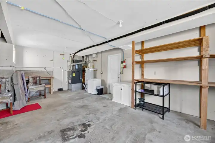 Two car garage with shelving and utility