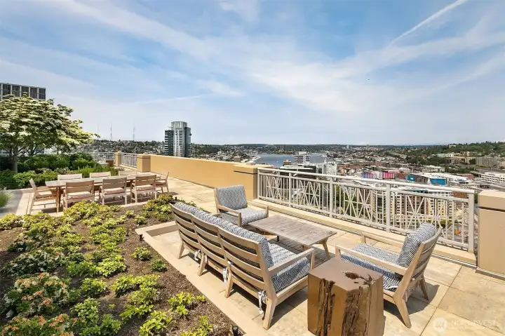 Roof-top VIEW deck with multiple lounging and dining areas Roof-top VIEW deck with multiple lounging and dining areas