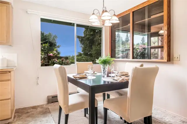 A dining area is located near the kitchen and offers a built-in display cabinet.
