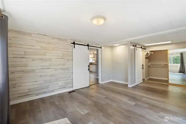 Primary bedroom also features a vanity nook and walk-in closet.