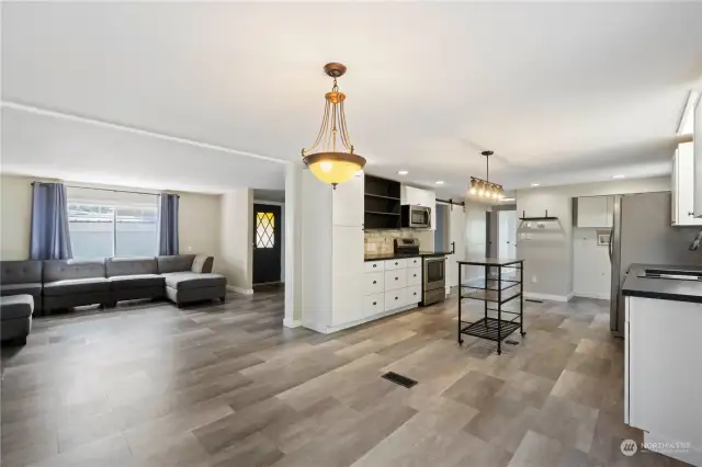 Gorgeous laminate flooring and updated light fixtures throughout.