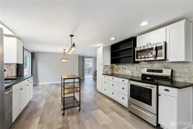 Tile backsplash and stainless-steel appliances.